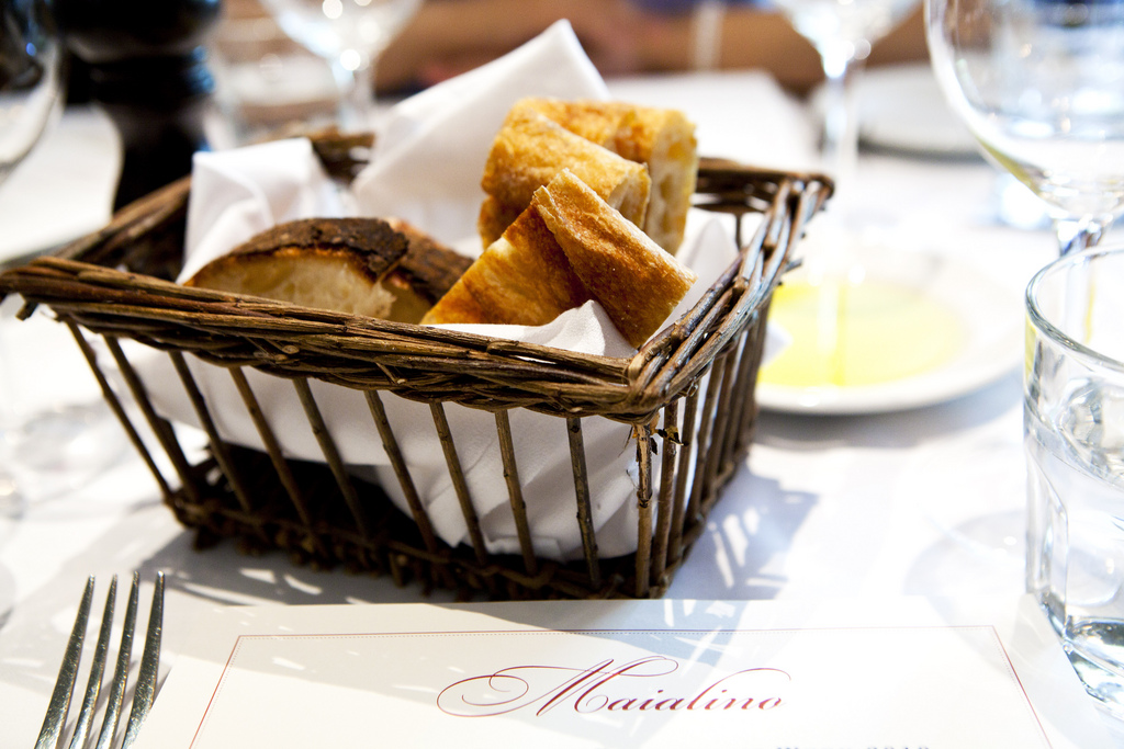 Bread basket, olive oil and menu