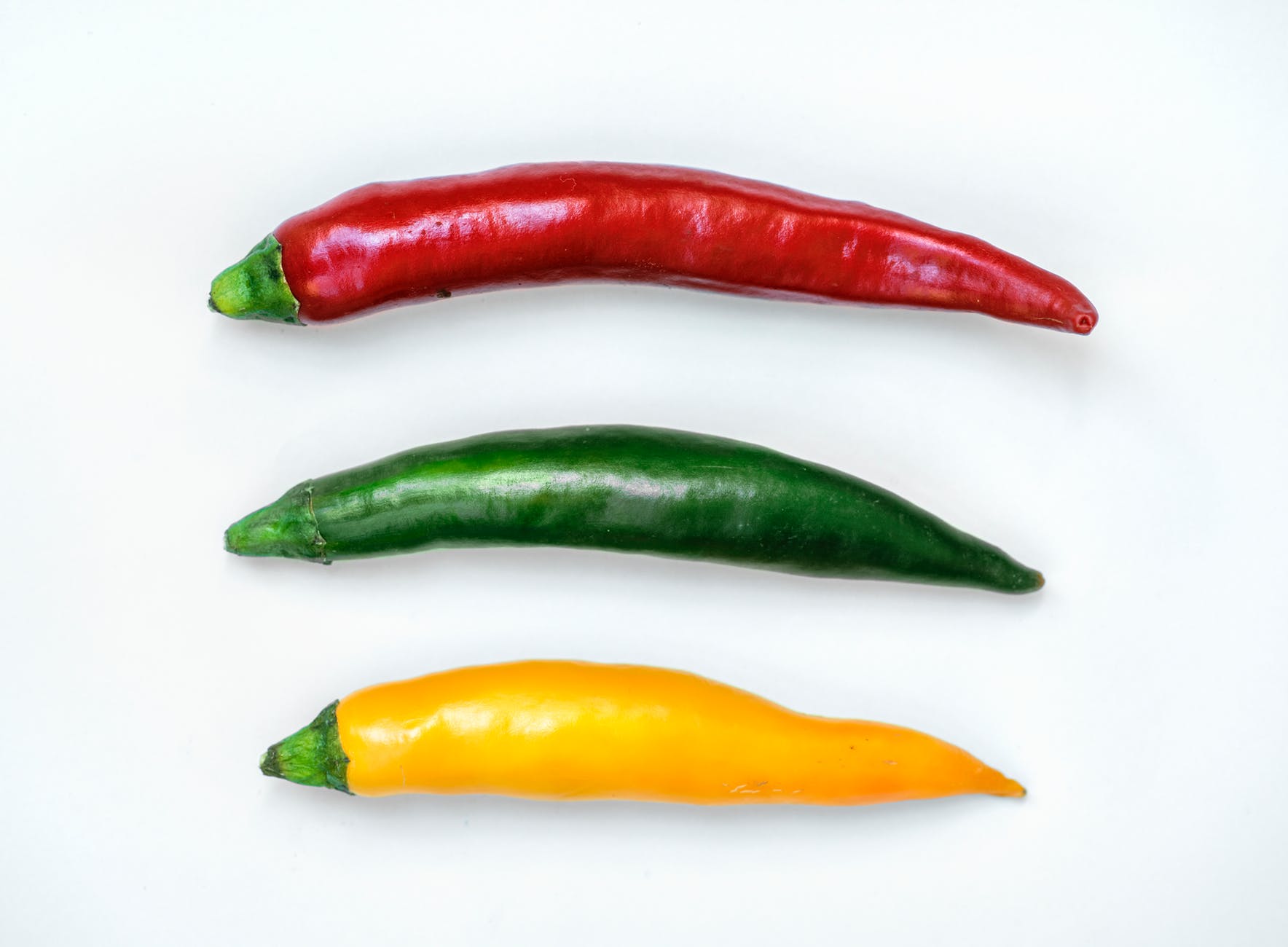 three red green and yellow chili